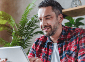 Man Reading Digital Tablet